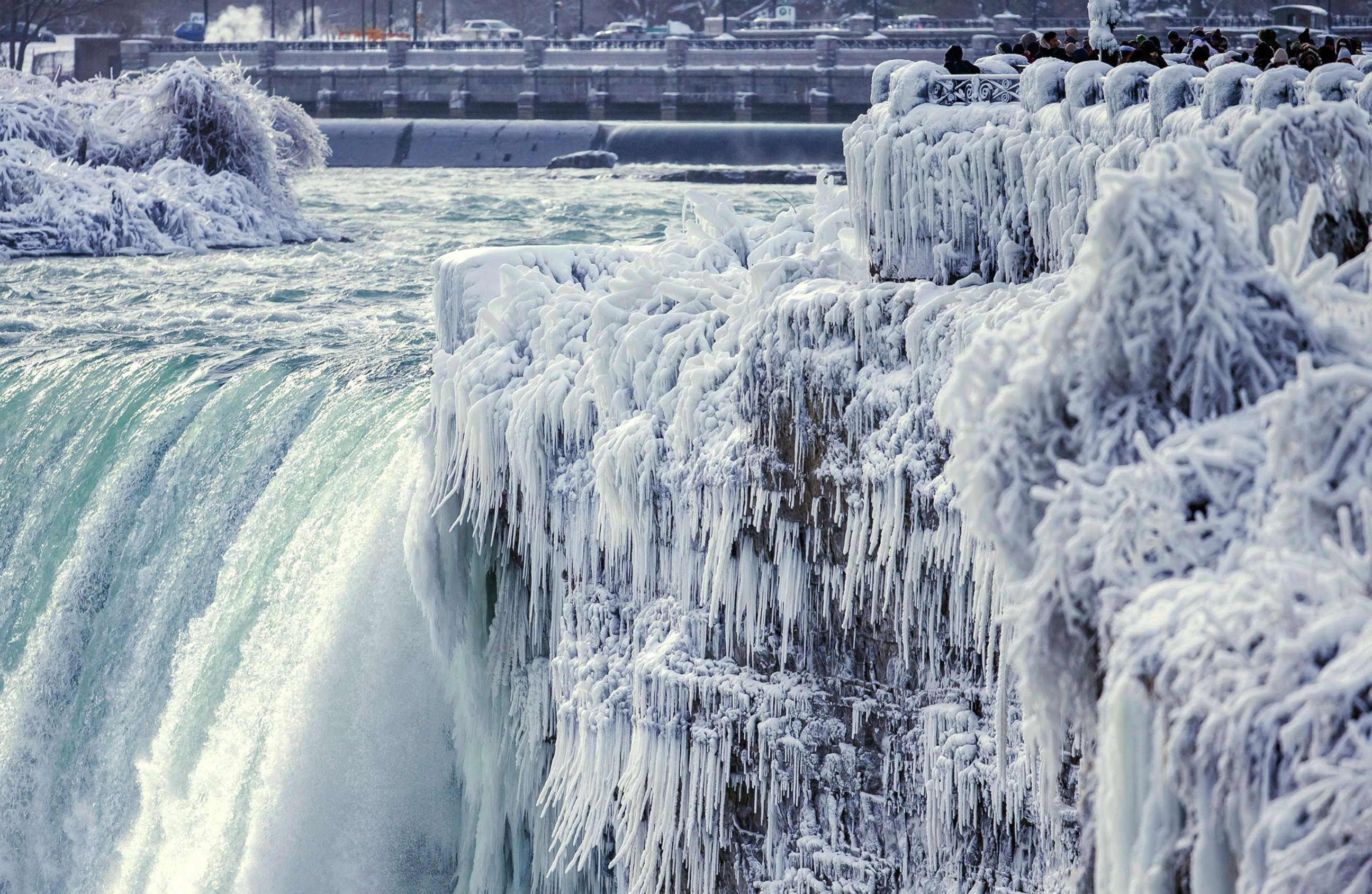 PHOTO: Visitors take photographs at the brink of the Horseshoe Falls in Niagara Falls, Ontario, Dec. 29, 2017.