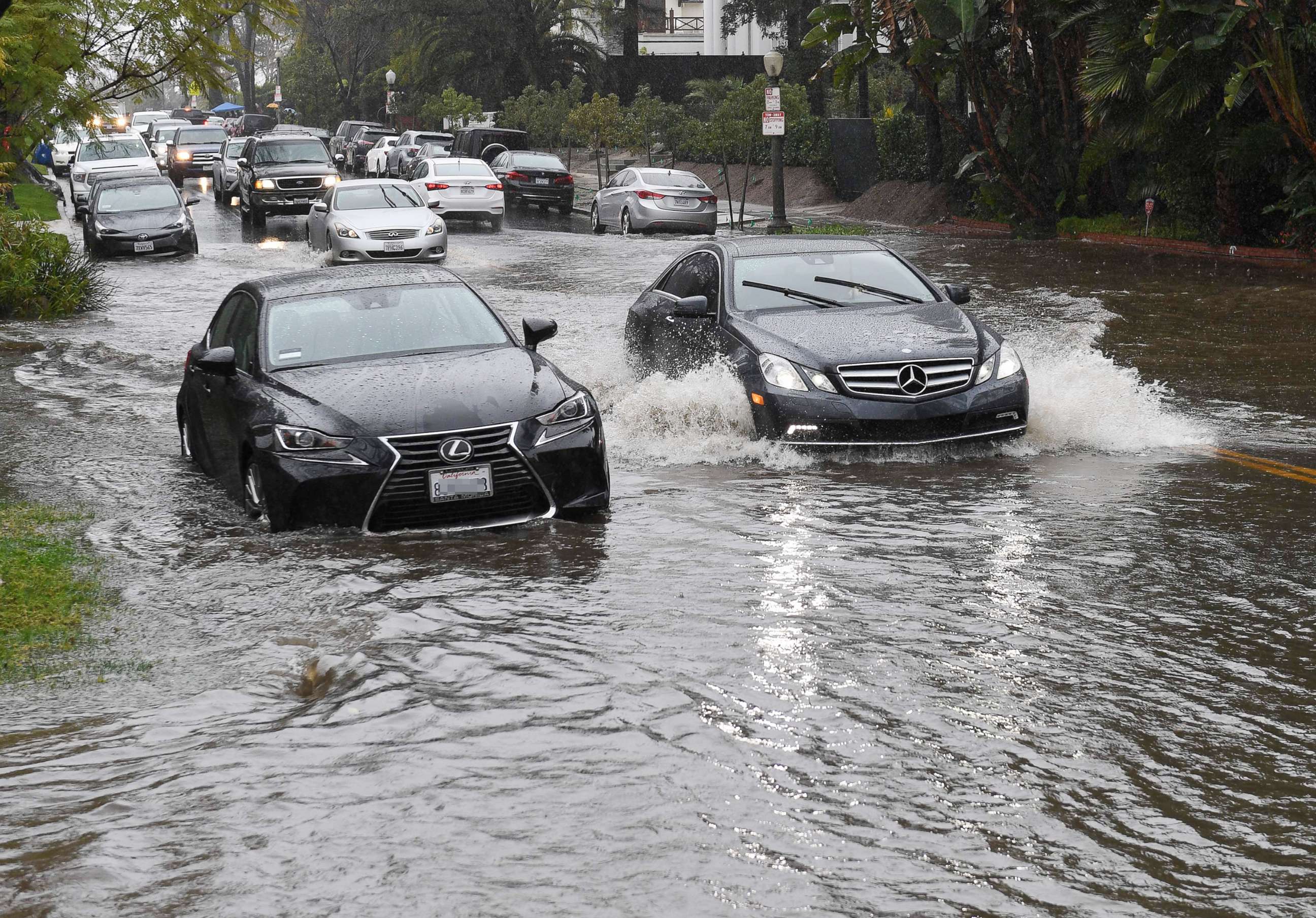 PHOTO: Cars drive through a flooded street after a storm dumped heavy rain on Los Angeles, Feb. 2, 2019.