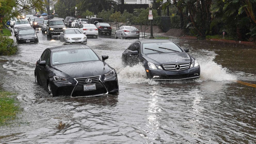 PHOTO: Cars drive through a flooded street after a storm dumped heavy rain on Los Angeles, Feb. 2, 2019.