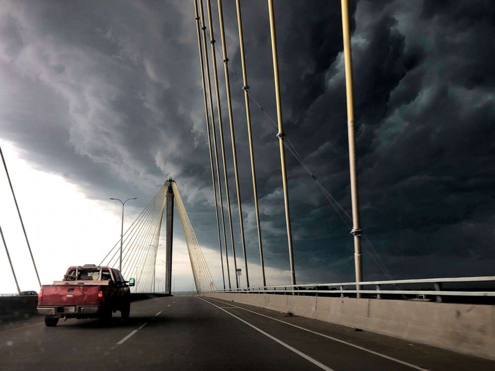 PHOTO: A truck drives east out of Alton, Ill., over the Clark Bridge as clouds from a severe warned thunderstorm roll in on Wednesday, July 17, 2019.