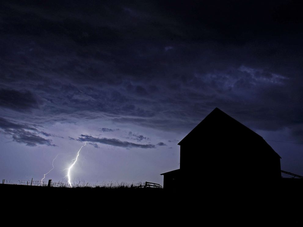 PHOTO: A barn is silhouetted against an approaching thunderstorm, Wednesday, July 31, 2019, near Tonganoxie, Kan.