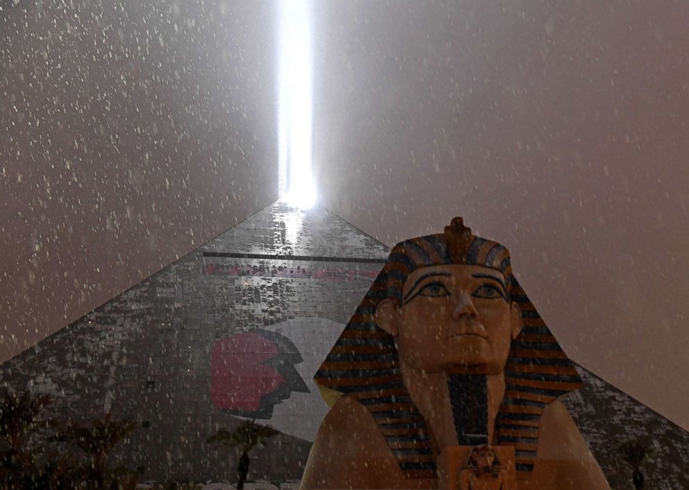 PHOTO: The light on top of Luxor Hotel and Casino illuminates snow falling during a winter storm, Feb. 20, 2019, in Las Vegas.