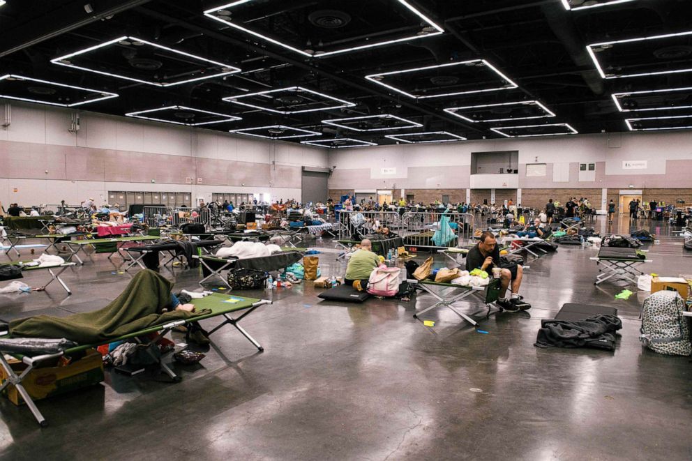 PHOTO: People rest at the Oregon Convention Center cooling station in Portland, June 28, 2021.