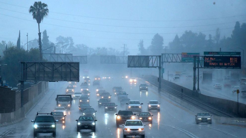 PHOTO: Commuters drive under heavy rainfall in Los Angeles, March 21, 2018. A slow-moving storm, billed as an "atmospheric river" began unleashing rain across southern California. 