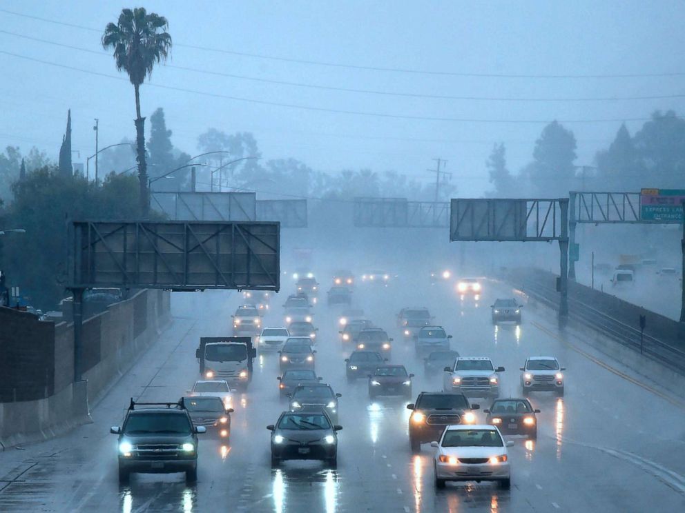 PHOTO: Commuters drive under heavy rainfall in Los Angeles, March 21, 2018. A slow-moving storm, billed as an atmospheric river began unleashing rain across southern California.