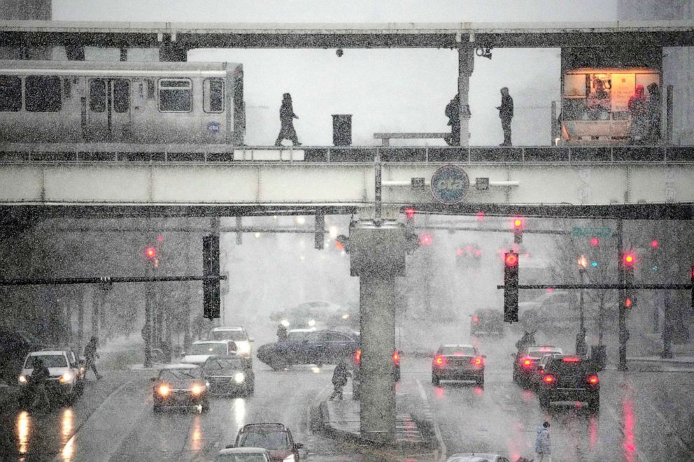 PHOTO: A Chicago Transit Authority train arrives at the Roosevelt train station as the leading edge of a winter storm begins in Chicago, Dec. 22, 2022.