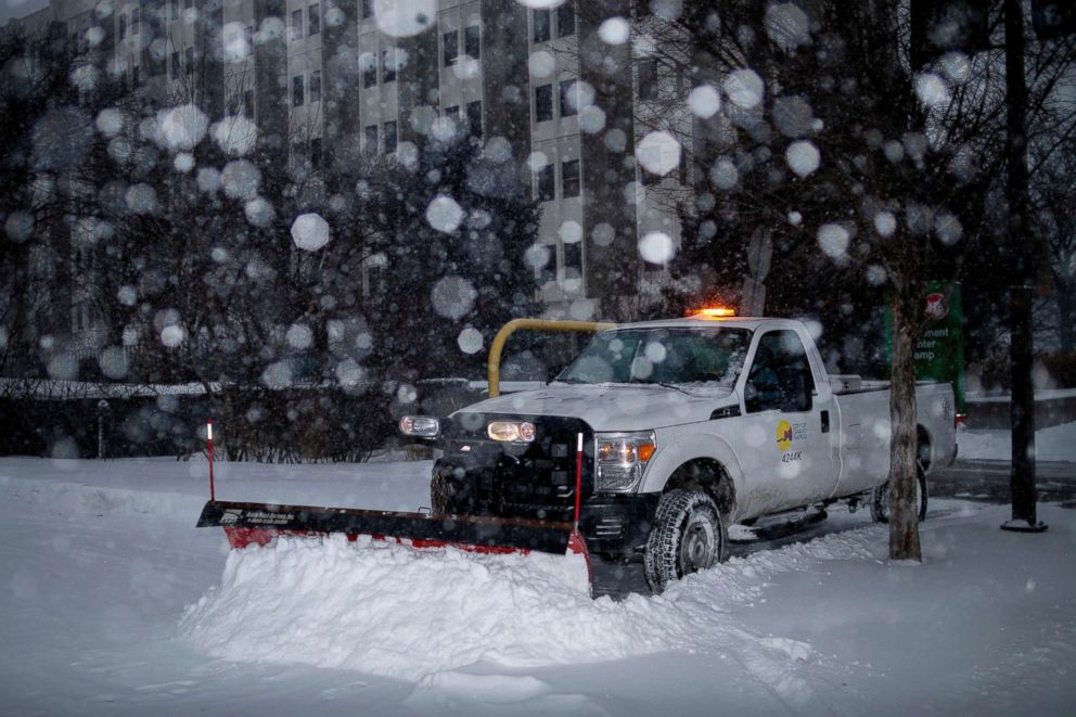 PHOTO: A city worker plows a sidewalk in Grand Rapids, Mich., Jan. 28, 2019. 