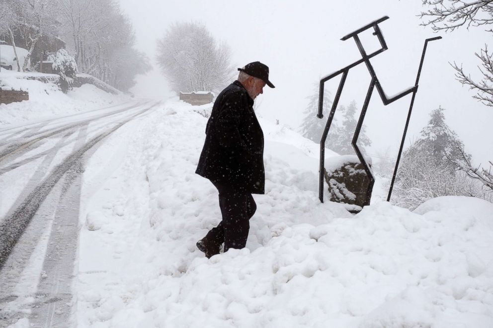 PHOTO: A man walks through the snow in Pedrafita do Cebreiro in Lugo, Spain, March 5, 2018.