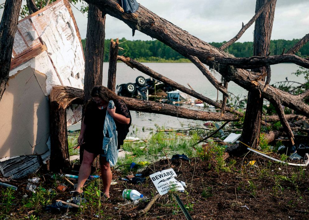 PHOTO: Missy Lattanzie searches through her belongings that were destroyed after a tornado touched down on the Naval Submarine Base Kings Bay in Kings Bay, Ga., July 8, 2021.