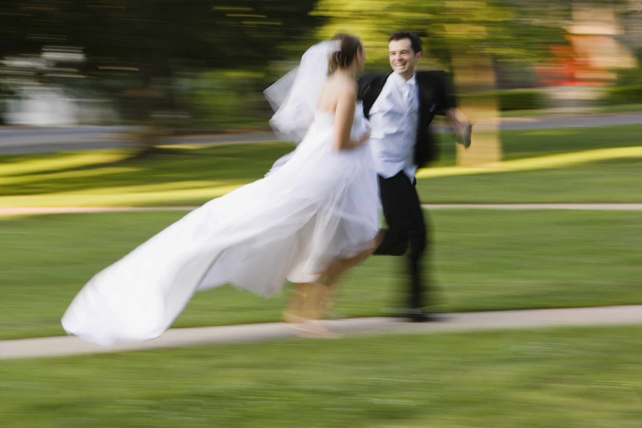 PHOTO: Bride and groom is running side by side in this stock image. 