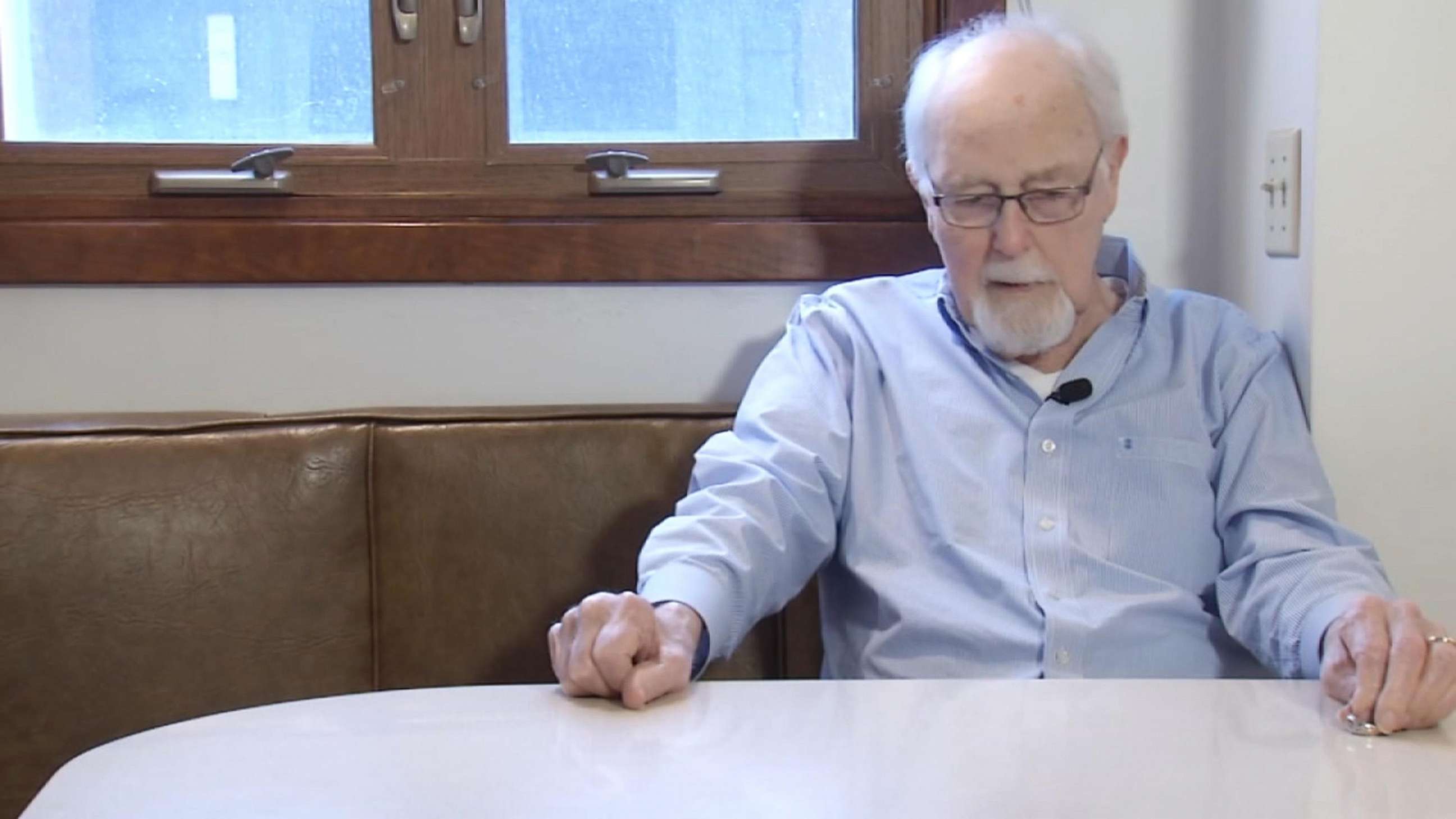 PHOTO: Ray Schmuecker looks at the ring he'd lost years ago.