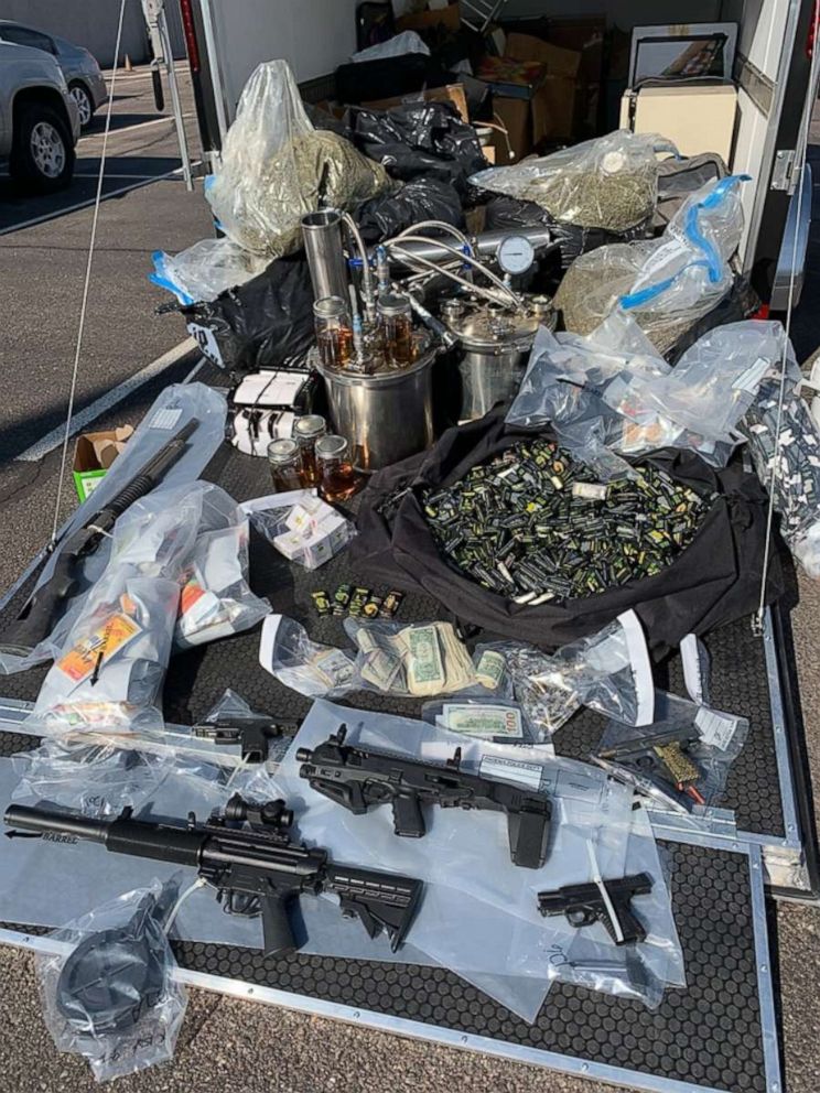 PHOTO: Guns, thousands of THC vaping cartridges, 300 pounds of marijuana and thousands in cash were seized from an alleged drug house in Phoenix on Thursday, Sept. 12, 2019.