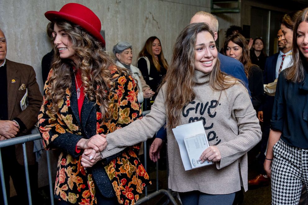 PHOTO: Actors Lauren Young, left, and Jessica Mann walk out of the courthouse after movie mogul Harvey Weinstein was sentenced to 23 years in prison on March 11, 2020 in New York City.