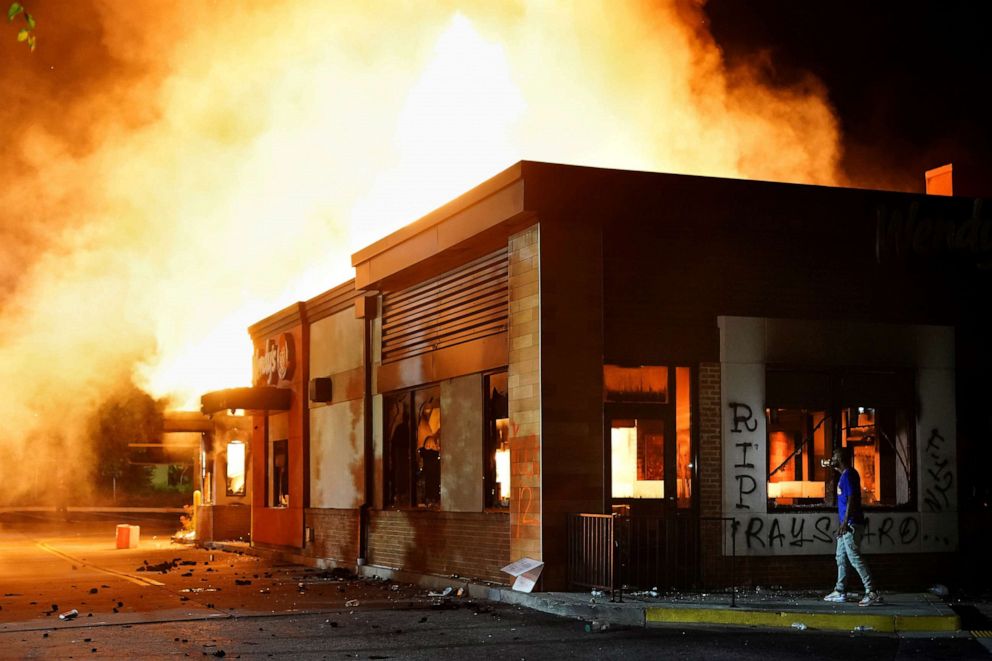 PHOTO: A Wendy's restaurant burns following a rally against racial inequality and the police shooting death of Rayshard Brooks, in Atlanta, June 13, 2020.