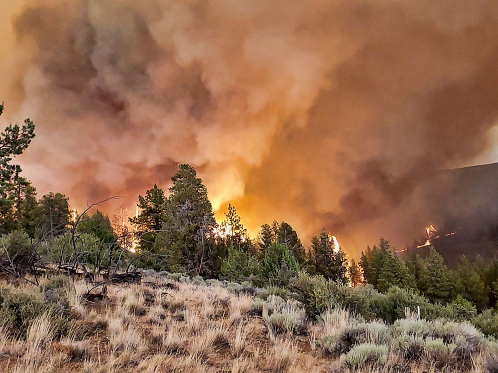 PHOTO: An active fire is seen along a ridge at the Grandview Fire near Sisters, Ore., Sunday, July 11, 2021.