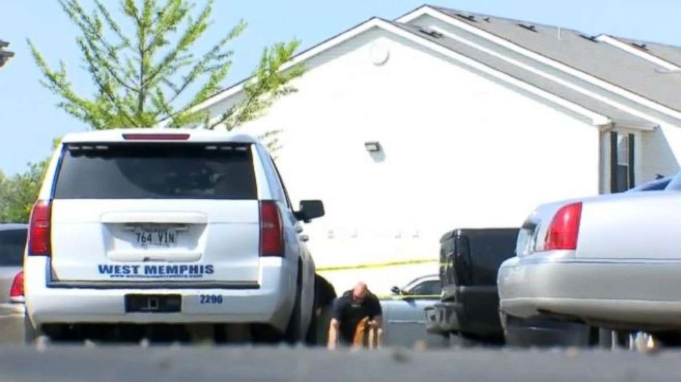 West Memphis police investigate the scene of a shooting where a police officer from nearby Forrest City was killed by a stray bullet on Saturday, April 28, 2018.