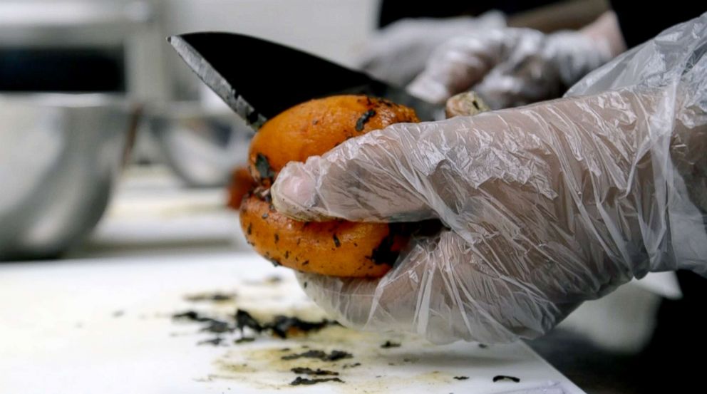 PHOTO: Westside Works culinary students practice their food preparation techniques.