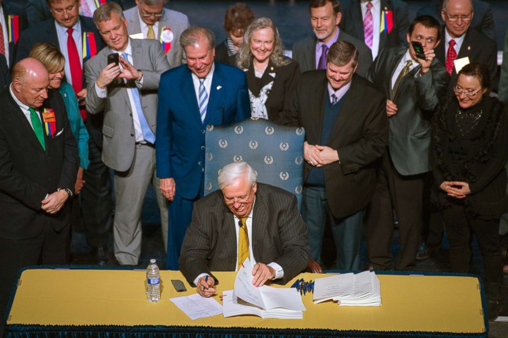 PHOTO: Gov. Jim Justice signs a bill increasing state workers salaries by 5 percent after the House and Senate passed the bill earlier in the day in Charleston, W.Va., on March 6, 2018.  

