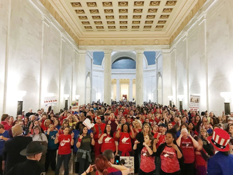 PHOTO: Teachers celebrate after West Virginia Gov. Jim Justice and Senate Republicans announced they reached a tentative deal to end a statewide teachers' strike by giving them 5 percent raises in Charleston, W.Va., March 6, 2018.