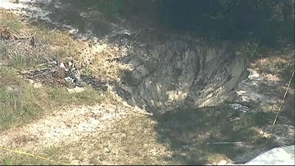 PHOTO:  A second sinkhole formed in Apopka, Florida, on Sept. 21, 2017, just yards away from a massive sinkhole that significantly damaged a home on Sept. 19, 2017. 
