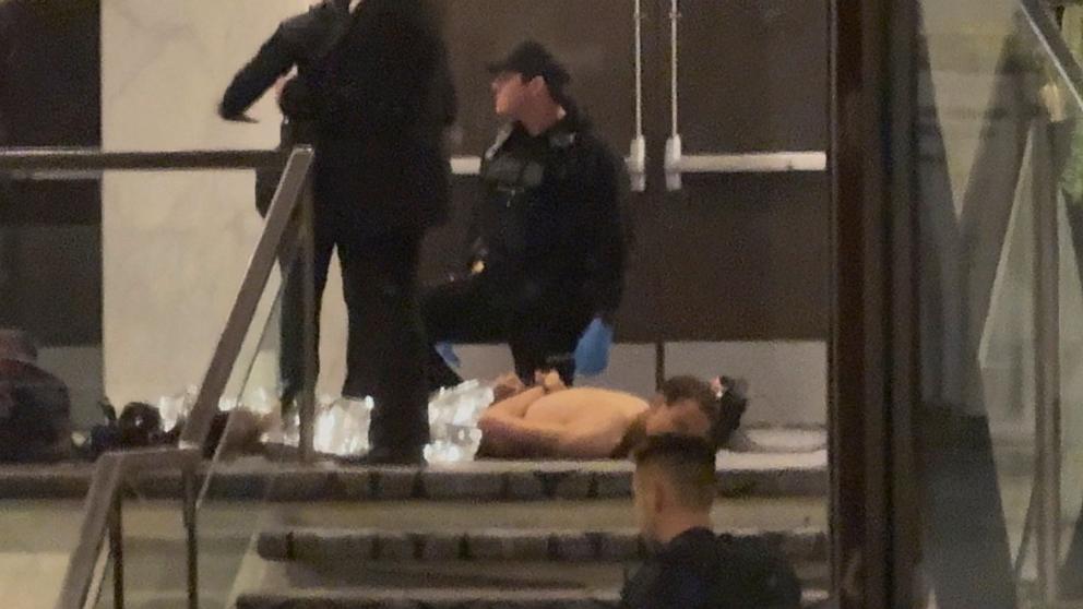 PHOTO: Cole Tomas Allen, a suspect in the shooting incident at the White House Correspondents' Association dinner, lies on the floor after being detained by law enforcement personnel, in Washington, April 25, 2026.