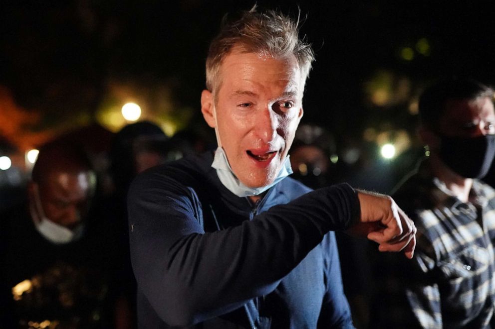 PHOTO: Portland Mayor Ted Wheeler reacts after being exposed to tear gas fired by federal officers while attending a protest against police brutality and racial injustice in front of the Mark O. Hatfield U.S. Courthouse on July 22, 2020, in Portland, Ore.