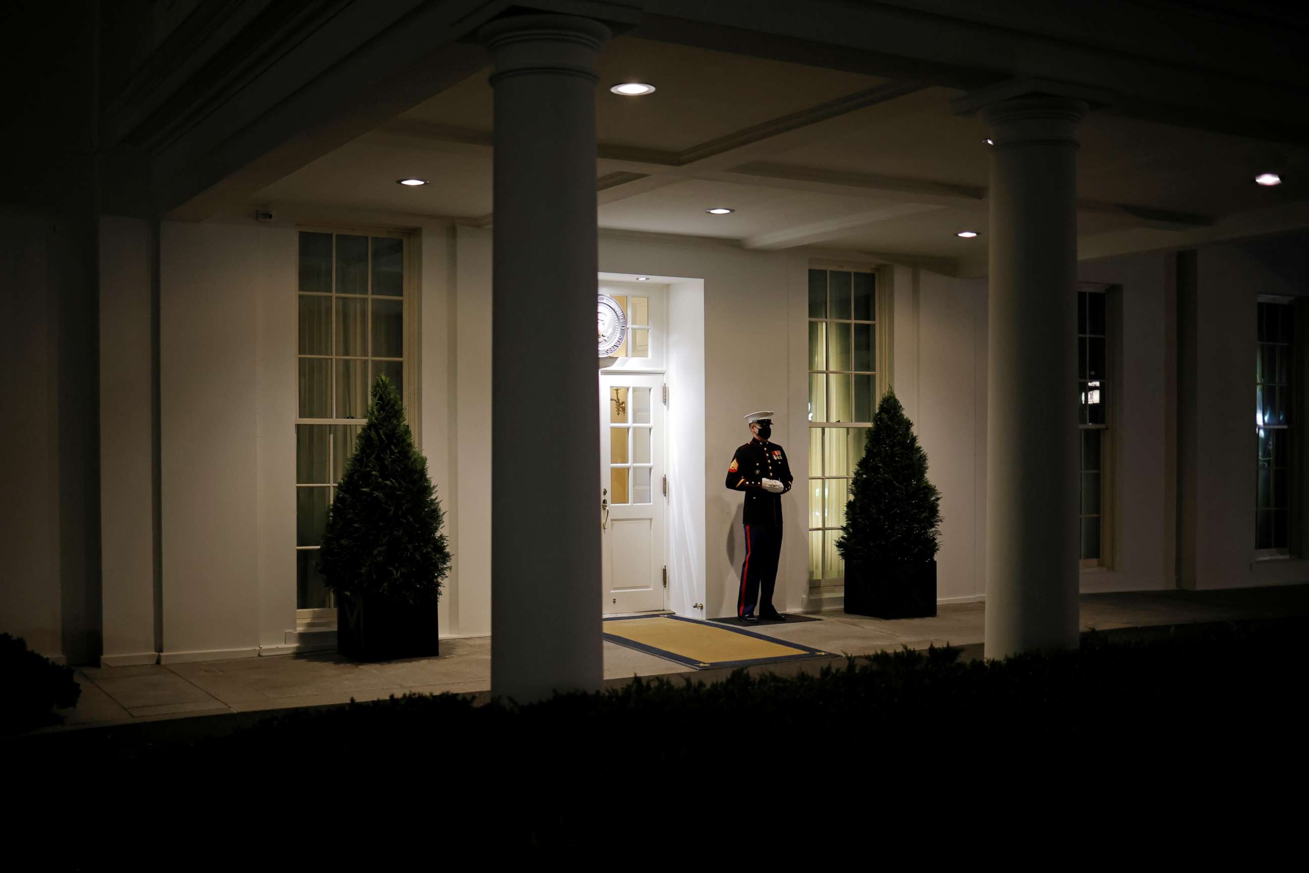 PHOTO: A U.S. Marine is seen posted at the West Wing door, an indication that President Donald Trump is in the Oval Office, after his supporters stormed the U.S. Capitol, in Washington, Jan. 6, 2021.
