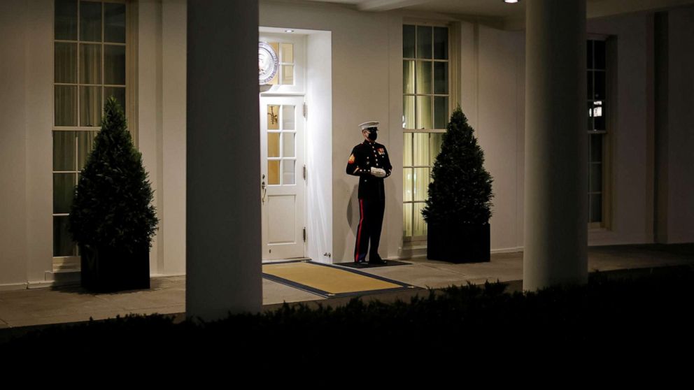 PHOTO: A U.S. Marine is seen posted at the West Wing door, an indication that President Donald Trump is in the Oval Office, after his supporters stormed the U.S. Capitol, in Washington, Jan. 6, 2021.