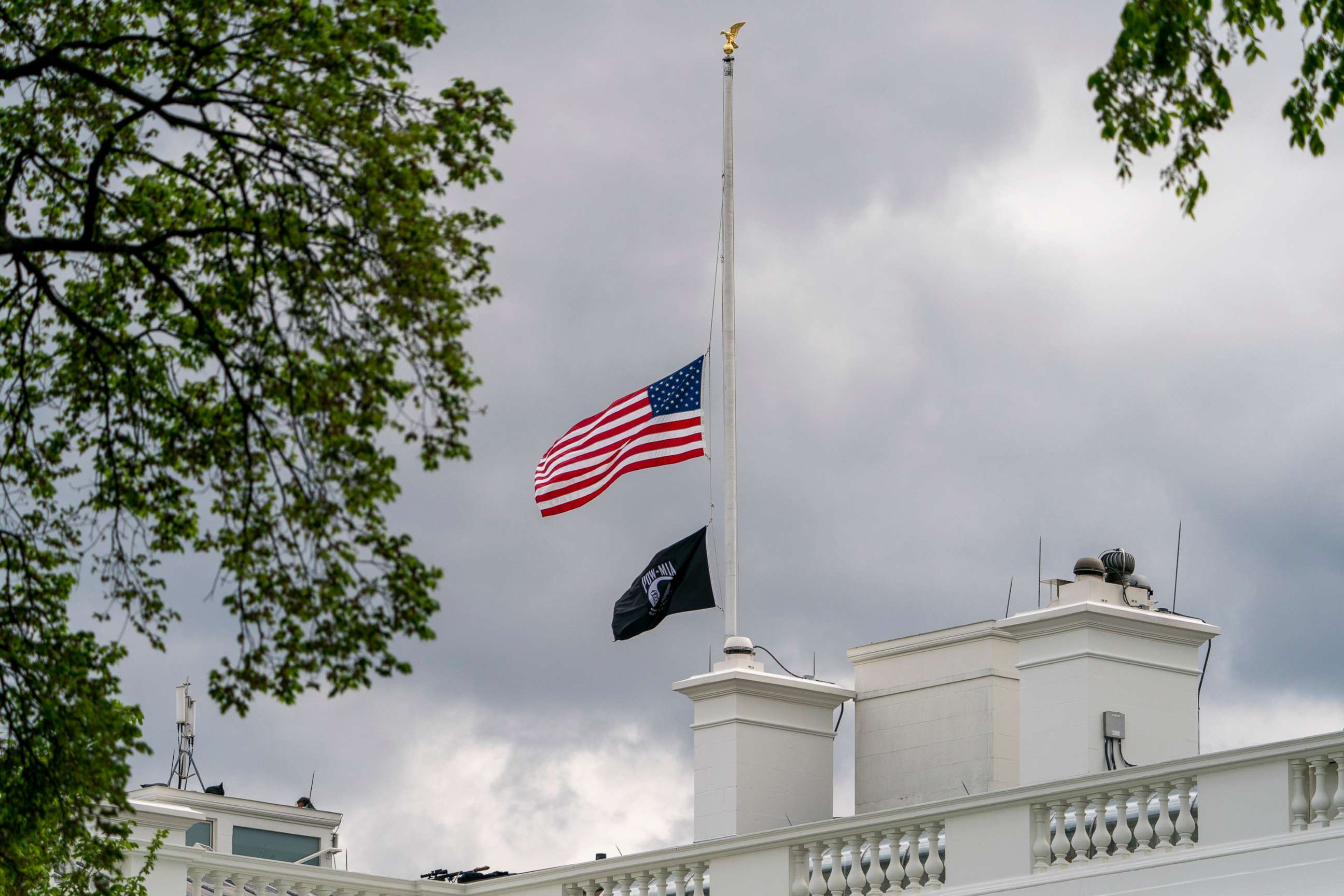 PHOTO: The American flag files at half-staff above the White House in Washington, D.C., April 16, 2021.