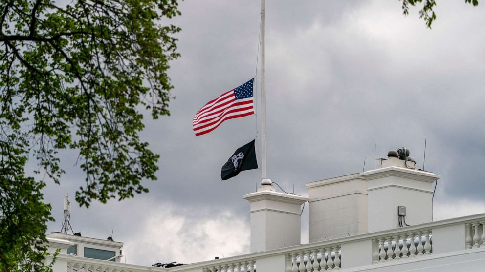 PHOTO: The American flag files at half-staff above the White House in Washington, D.C., April 16, 2021.