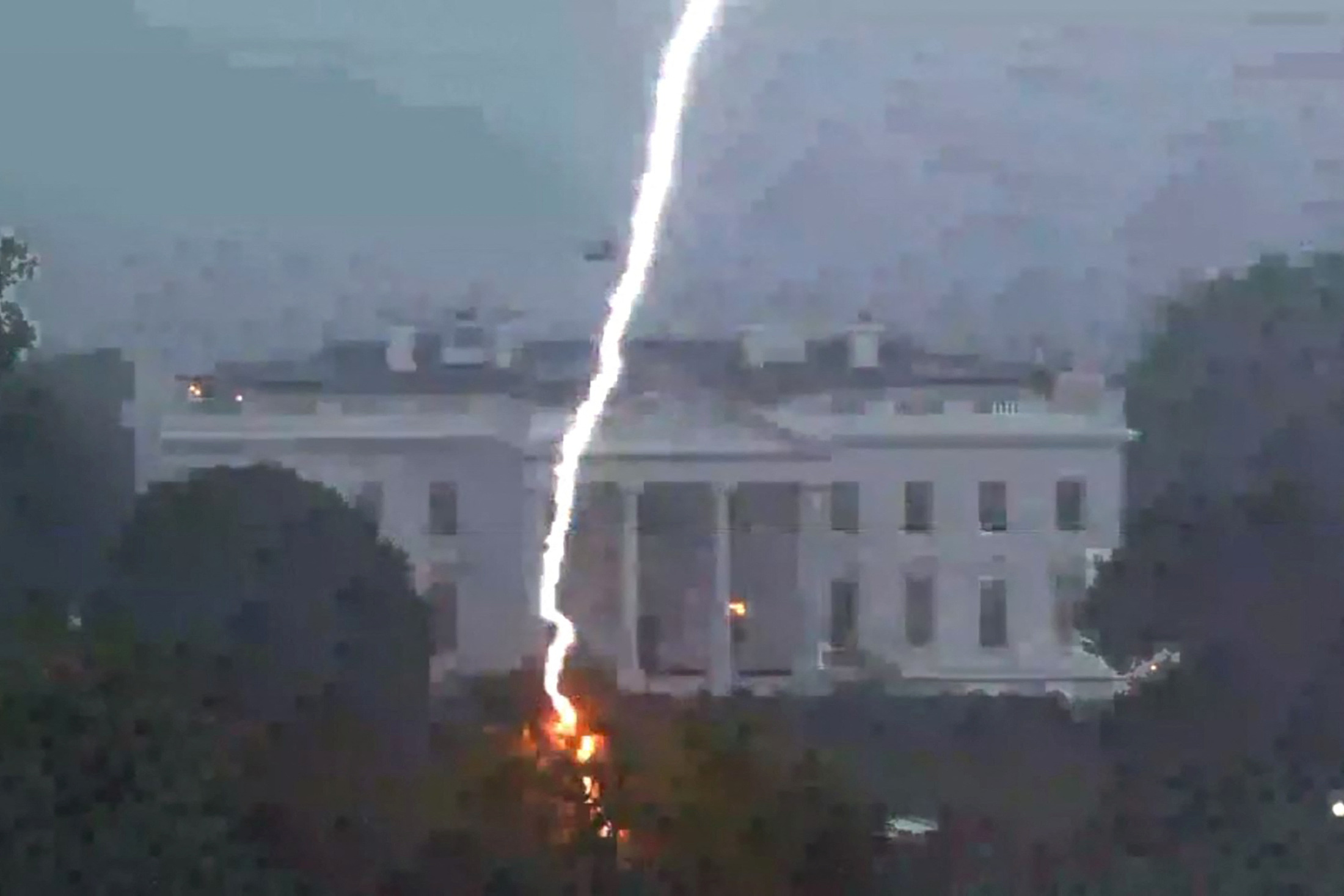 PHOTO: A lightning strike hits a tree in Lafayette Park across from the White House, killing two people and injuring two others, during a thunderstorm as seen in this framegrab from a video camera mounted on a nearby rooftop in Washington, Aug. 4, 2022.