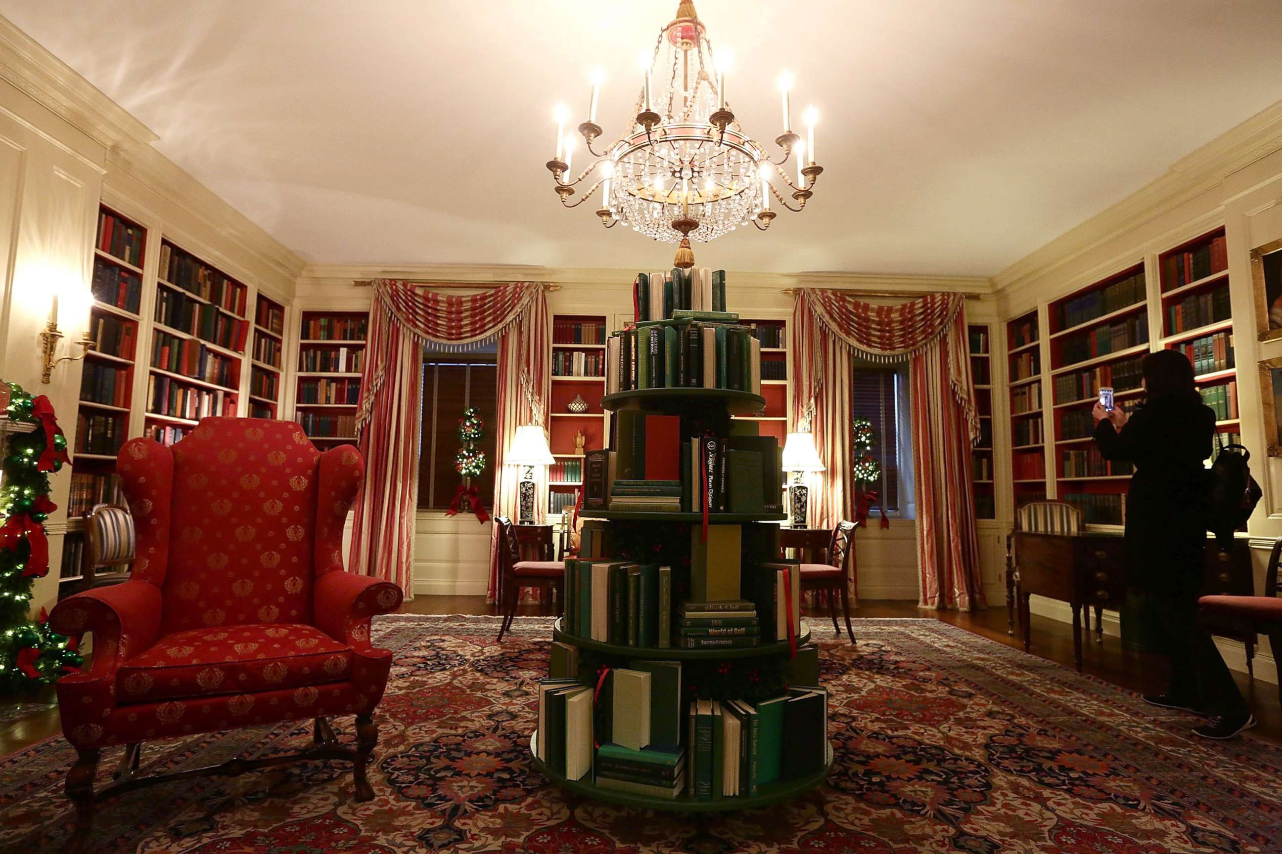 PHOTO: The library at the White House with a tree made of books, during a press preview of the 2017 holiday decorations Nov. 27, 2017.