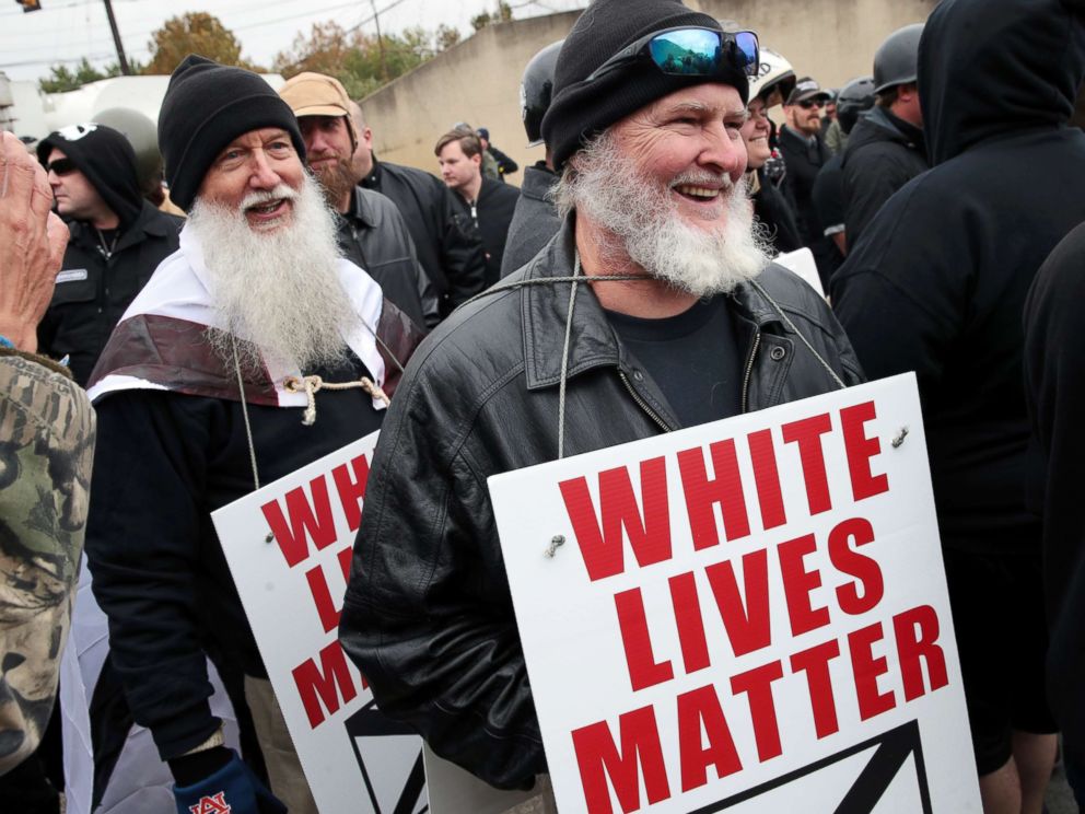 PHOTO: People hold signs during a white nationalist rally rally on October 28, 2017 in Shelbyville, Tenn.