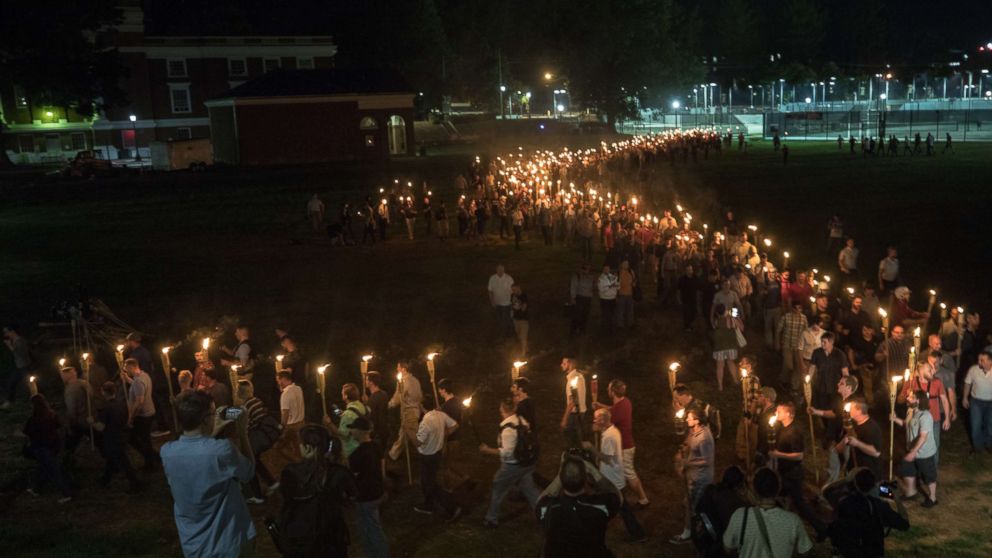 White nationalists and white supremacists carrying torches marched in a parade through the University of Virginia campus.