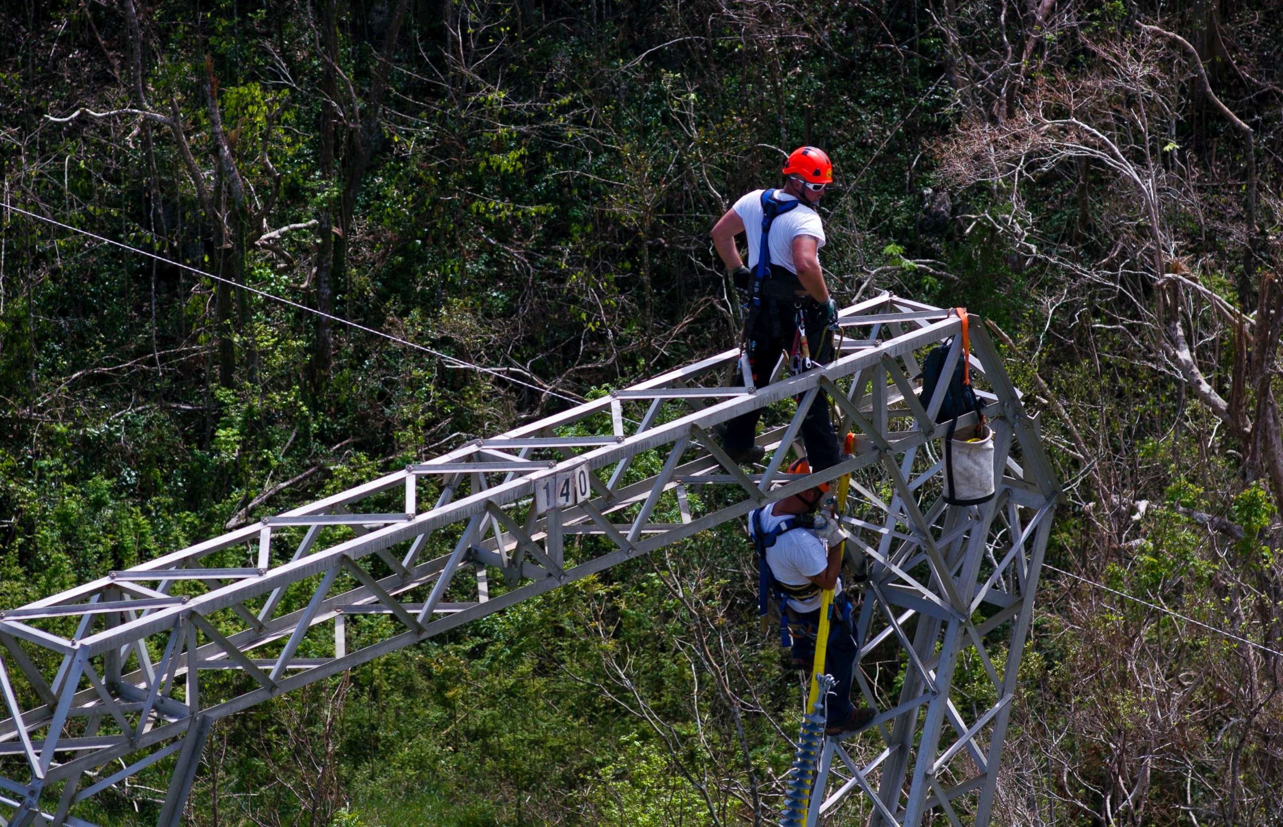 PHOTO: Whitefish Energy Holdings workers restore power lines damaged by Hurricane Maria in Barceloneta, Puerto Rico, Oct. 15, 2017. 
