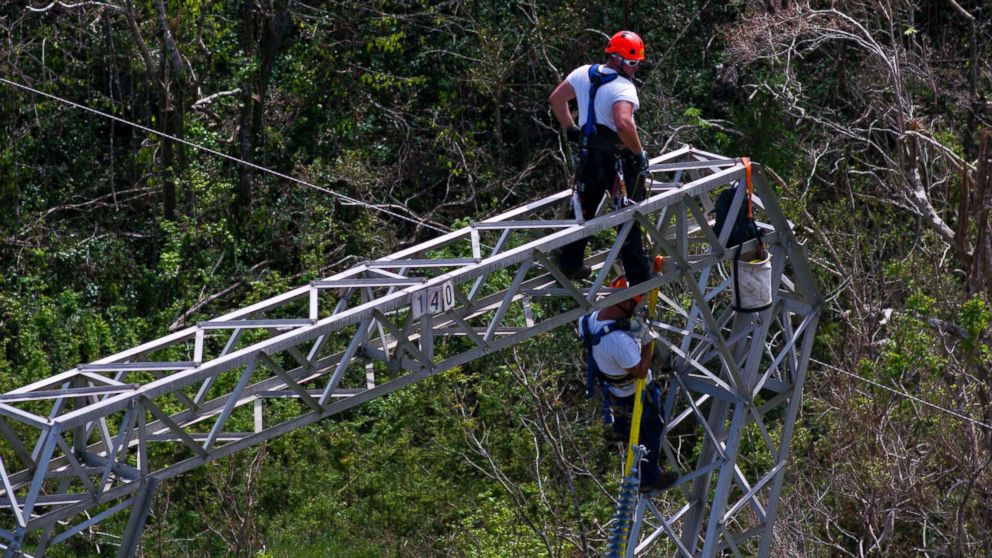 PHOTO: Whitefish Energy Holdings workers restore power lines damaged by Hurricane Maria in Barceloneta, Puerto Rico, Oct. 15, 2017. 