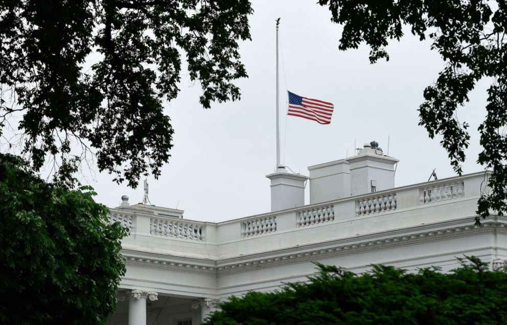   PHOTO: The American flag is lowered to half the staff at the White House in Washington on May 18, 2018. President Donald Trump ordered half-members to honor the victims during the shooting at Santa Fe High School 