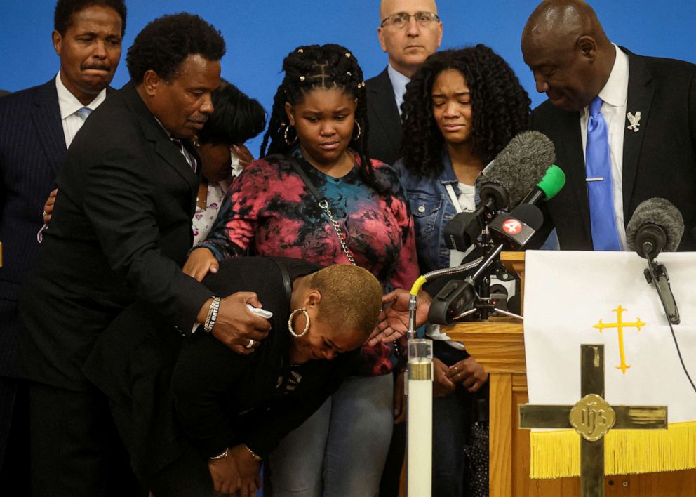 PHOTO: Attorney Ben Crump comforts family members of Ruth Whitfield, who was killed during a shooting at a Tops supermarket, during a news conference in Buffalo, New York, May 16, 2022.