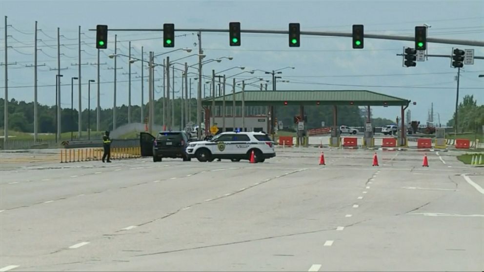 PHOTO: An image from WHNT showing Huntsville Police at one of the gates to the Redstone Arsenal. All gates were shut down.   