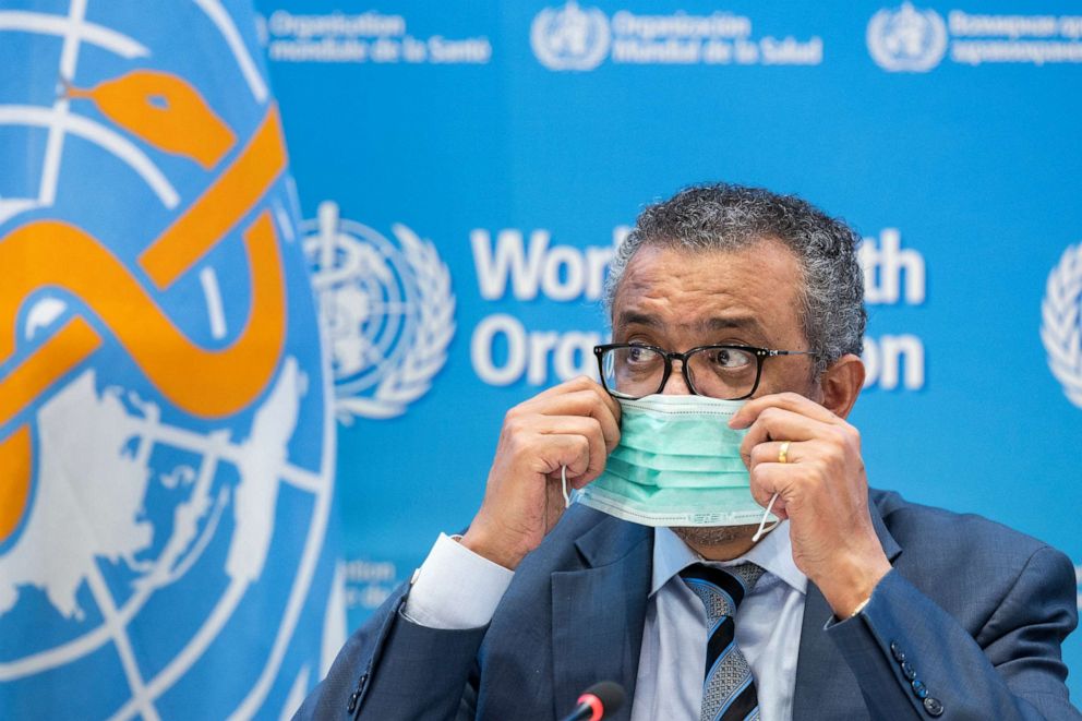 PHOTO: Tedros Adhanom Ghebreyesus, Director General of the World Health Organization (WHO), removes his protective face mask prior to speaking at the World Health Organization (WHO) headquarters in Geneva, Switzerland, Dec. 20, 2021.