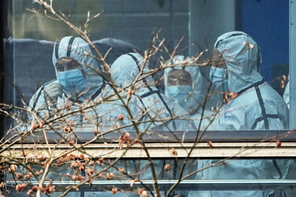 PHOTO: Members of the World Health Organization team investigating the origins of the COVID-19 coronavirus are seen during their visit to the Hubei Center for animal disease control and prevention in Wuhan, China's central Hubei province on Feb. 2, 2021.