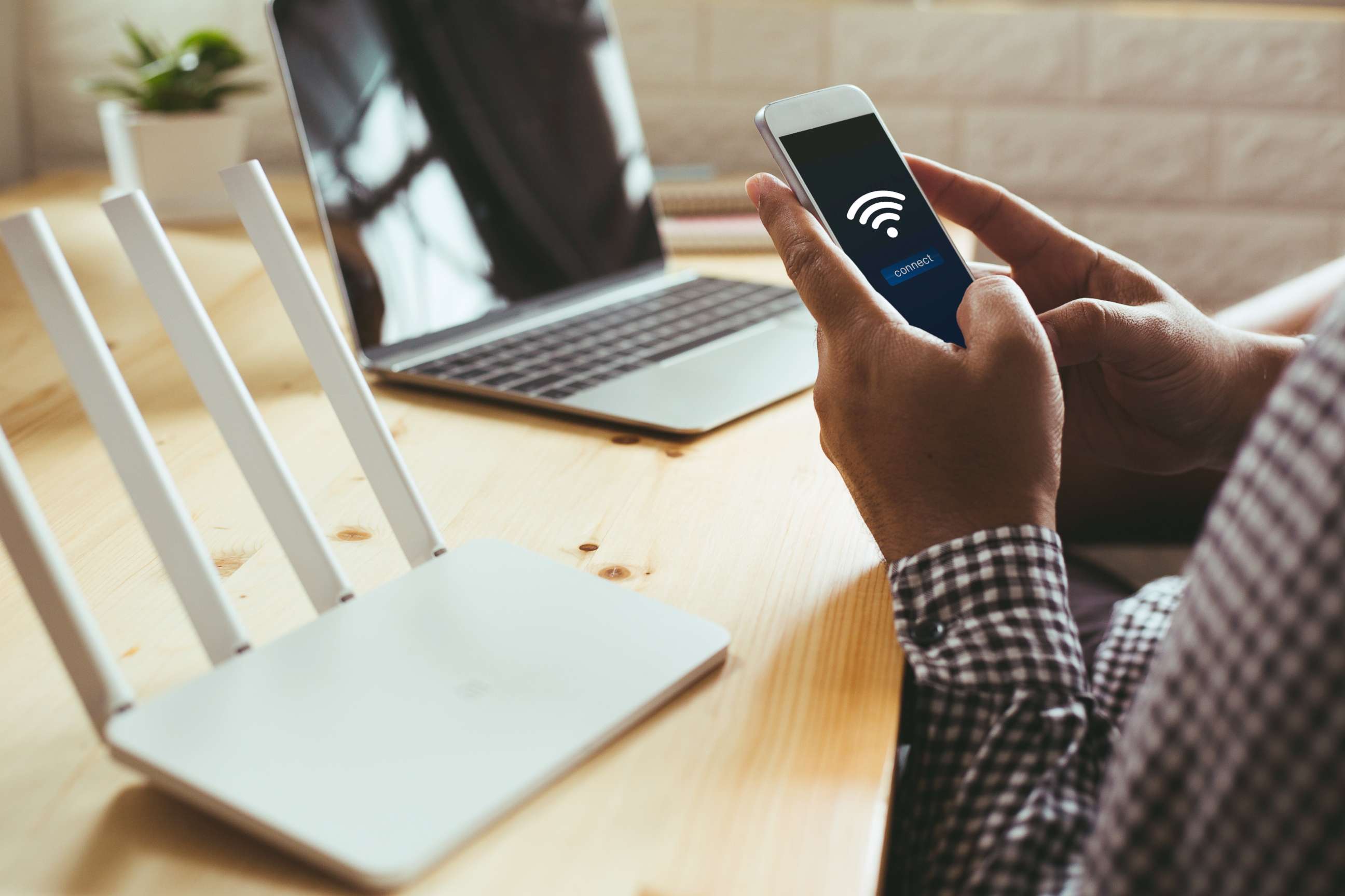 PHOTO: A person connects to Wi-Fi in this stock photo.