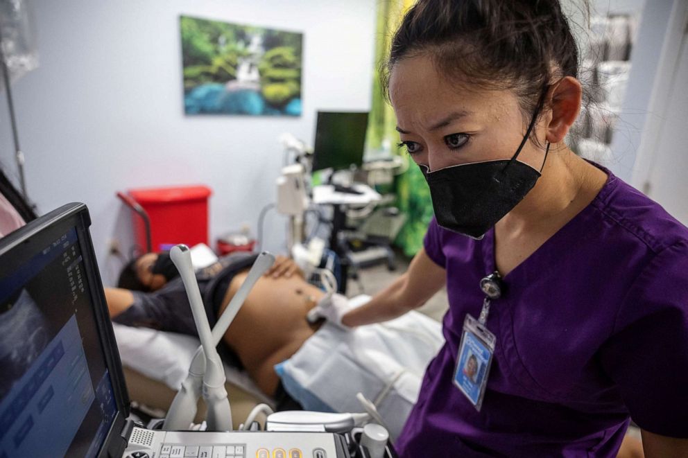 PHOTO: Dr. Shelly Tien, 40, performs an ultrasound on MC, 24, who is in her second trimester, at Planned Parenthood in Jacksonville, Florida, March 15, 2022.