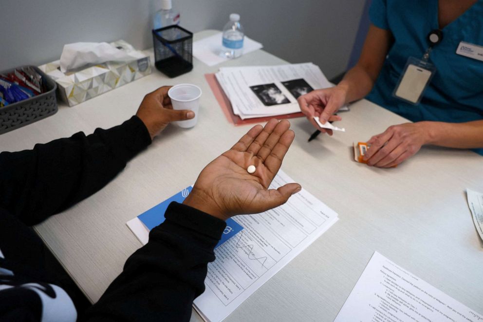 PHOTO: Dr. Shelly Tien, 40, gives a patient medication to start a medical abortion at Planned Parenthood in Birmingham, Alabama, March 14, 2022.