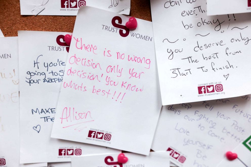 PHOTO: Handwritten notes of encouragement are pinned to the wall of a waiting room at the Trust Women clinic in Oklahoma City, Dec. 6, 2021.