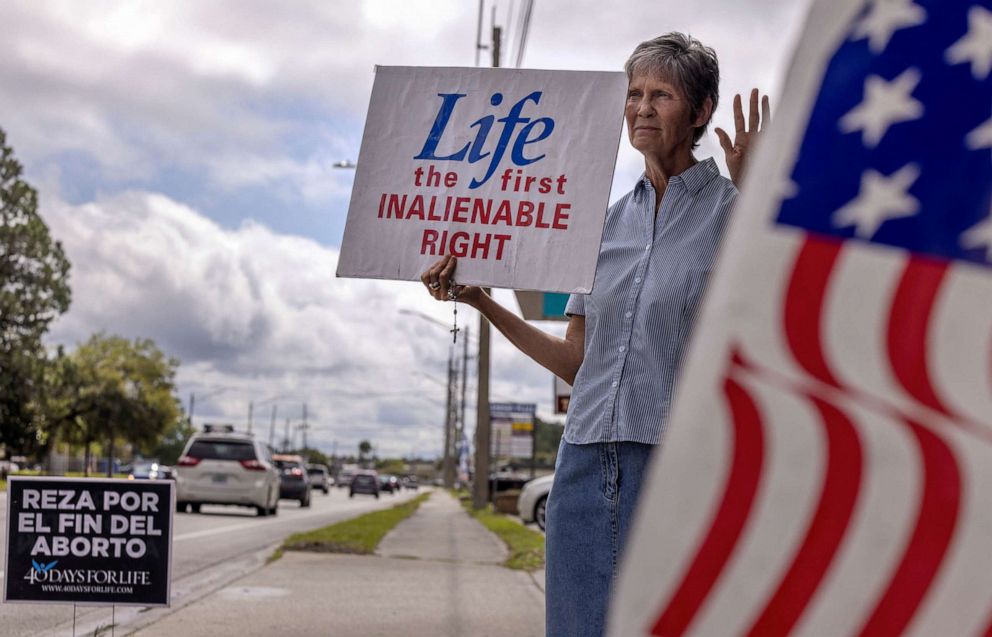 PHOTO: Patricia, an anti-abortion protestor, stands outside Planned Parenthood in Jacksonville, Florida, March 16, 2022.