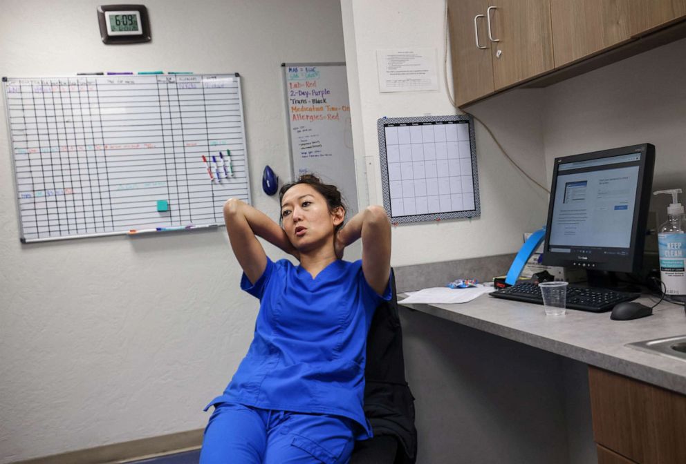 PHOTO: Dr. Shelly Tien, 40, sits at her desk after finishing the last abortion of the day at the Trust Women clinic in Oklahoma City, Dec. 6, 2021.