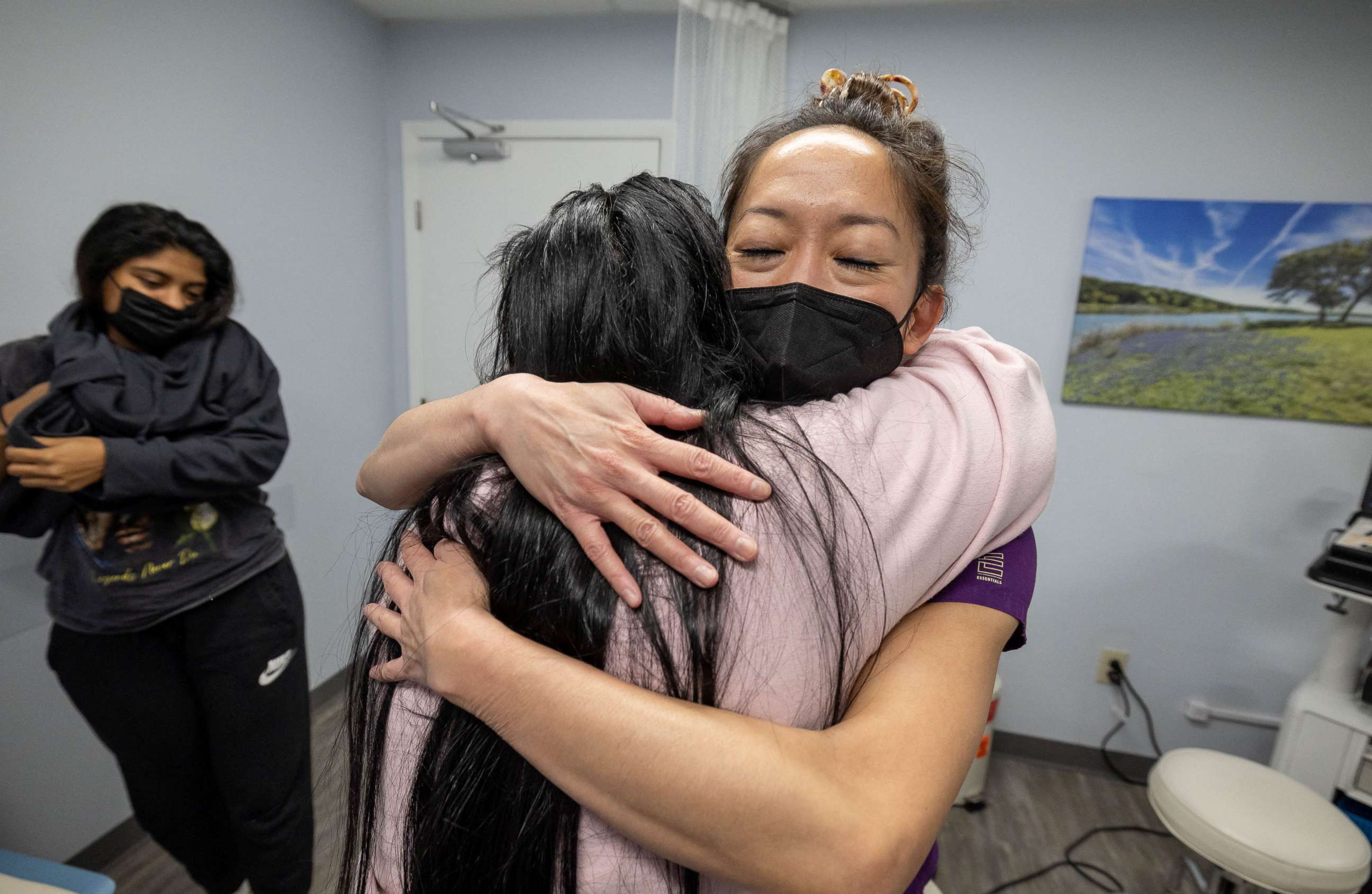 PHOTO: OC, the older sister of pregnant MC, 24, hugs Dr. Shelly Tien, 40, in gratitude, following her sister's appointment at Planned Parenthood in Jacksonville, Florida, March 15, 2022.