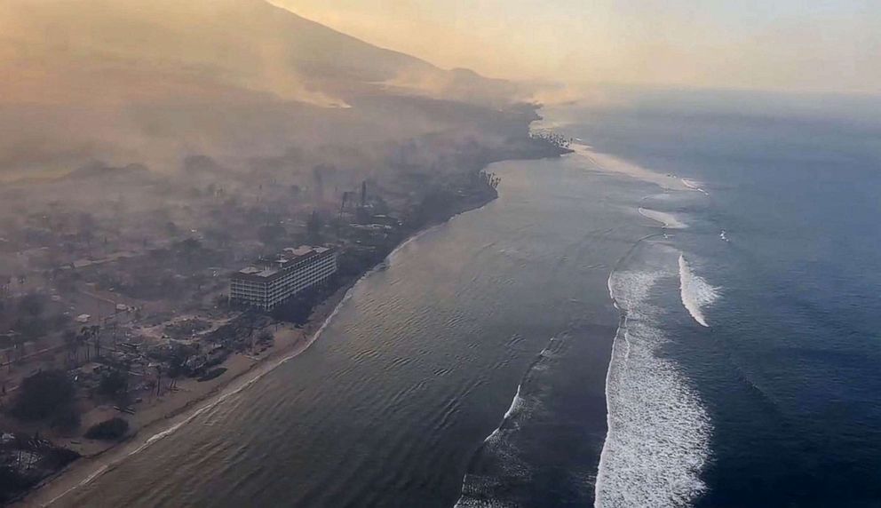 PHOTO: This handout video grab courtesy of Richard Olsten taken Aug. 9, 2023 shows smoke billowing from destroyed buildings as wildfires burn across Maui, Hawaii.