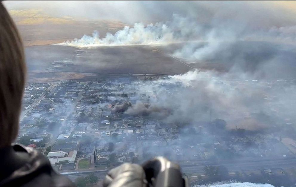 PHOTO: This handout video grab courtesy of Richard Olsten taken Aug. 9, 2023 shows smoke billowing from destroyed buildings as wildfires burn across Maui, Hawaii.